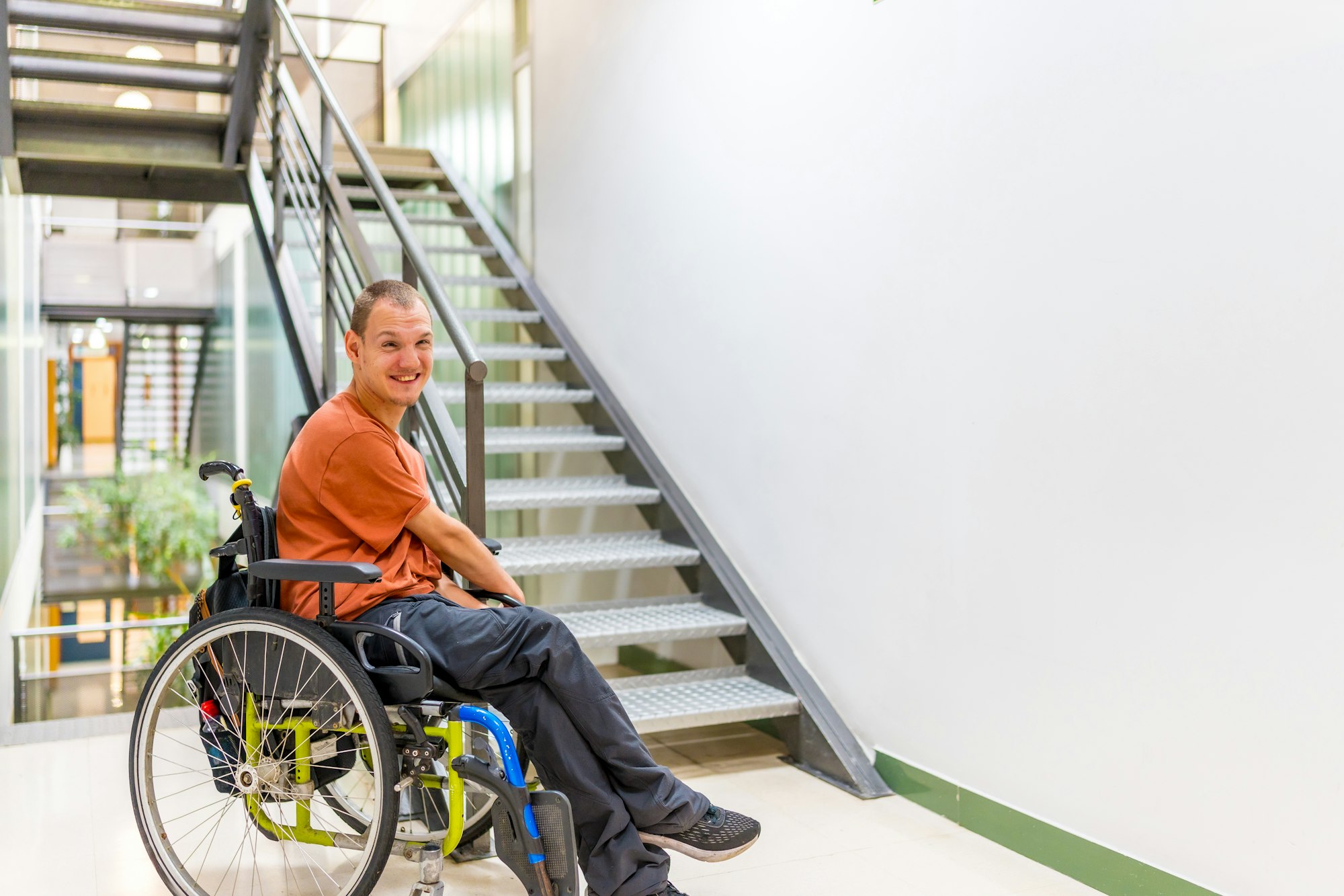 Man with cerebral palsy on a coworking