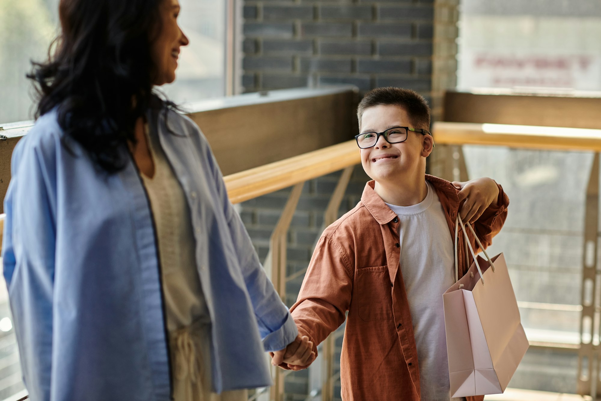 Mother and sons shopping mall stroll